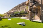 Spacious turf area with corn hole and views